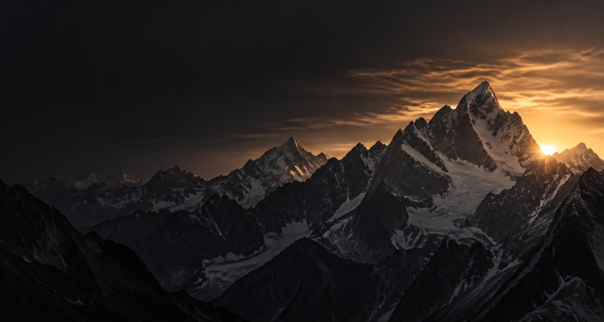 Jagged alpine peaks catching the last champagne light of dusk